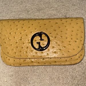 Yellow faux snake skin leather clutch
